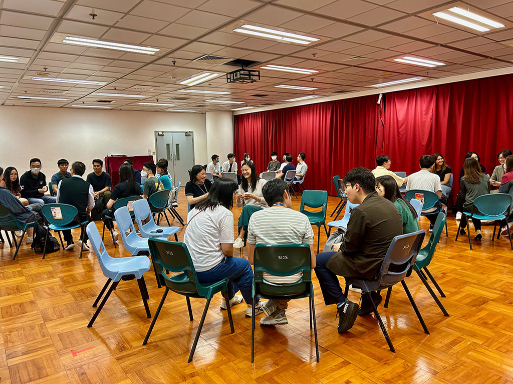 Faculty and students engaged in lively discussions.
