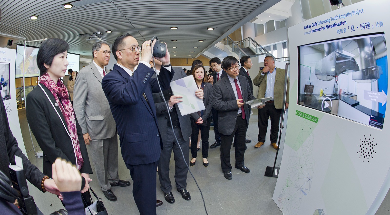 Guests visit the exhibition of the “Jockey Club Enhancing Youth Empathy Project through Immersive Visualisation”.
